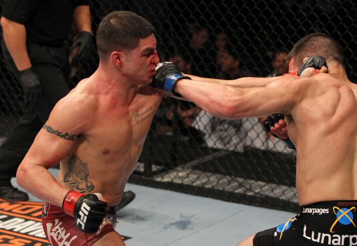 OMAHA, NE - FEBRUARY 15: (L-R) Diego Sanchez and Jake Ellenberger trade punches during the UFC on FUEL TV event at Omaha Civic Auditorium on February 15, 2012 in Omaha, Nebraska. (Photo by Josh Hedges/Zuffa LLC/Zuffa LLC via Getty Images) *** Local Capt