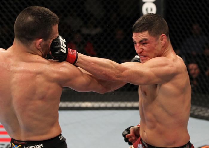 OMAHA, NE - FEBRUARY 15: (R-L) Diego Sanchez and Jake Ellenberger trade punches during the UFC on FUEL TV event at Omaha Civic Auditorium on February 15, 2012 in Omaha, Nebraska. (Photo by Josh Hedges/Zuffa LLC/Zuffa LLC via Getty Images) *** Local Capt