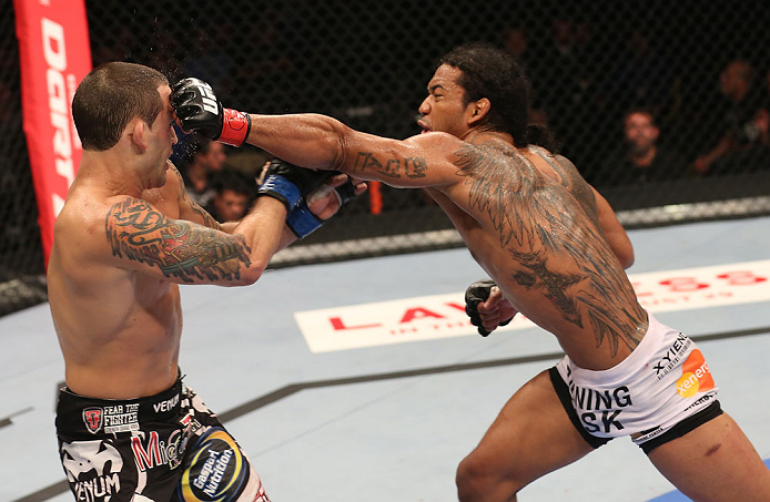 DENVER, CO - AUGUST 11: (R-L) Benson Henderson punches Frankie Edgar during their lightweight championship bout at UFC 150 inside Pepsi Center on August 11, 2012 in Denver, Colorado. (Photo by Nick Laham/Zuffa LLC/Zuffa LLC via Getty Images)