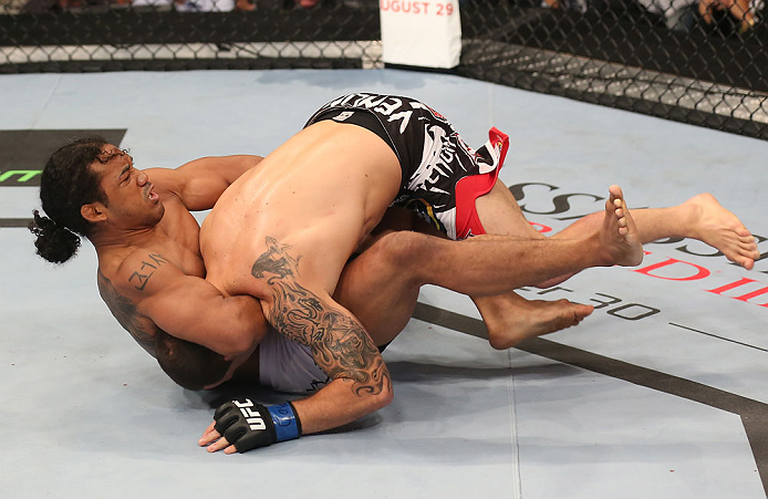 DENVER, CO - AUGUST 11: (R-L) Benson Henderson attempts a guillotine choke submission against Frankie Edgar during their lightweight championship bout at UFC 150 inside Pepsi Center on August 11, 2012 in Denver, Colorado. (Photo by Nick Laham/Zuffa LLC/Z