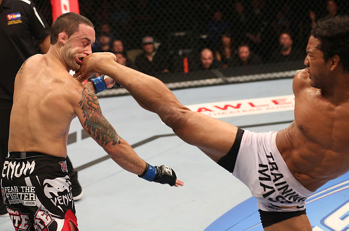 DENVER, CO - AUGUST 11: (R-L) Benson Henderson kicks Frankie Edgar during their lightweight championship bout at UFC 150 inside Pepsi Center on August 11, 2012 in Denver, Colorado. (Photo by Nick Laham/Zuffa LLC/Zuffa LLC via Getty Images)