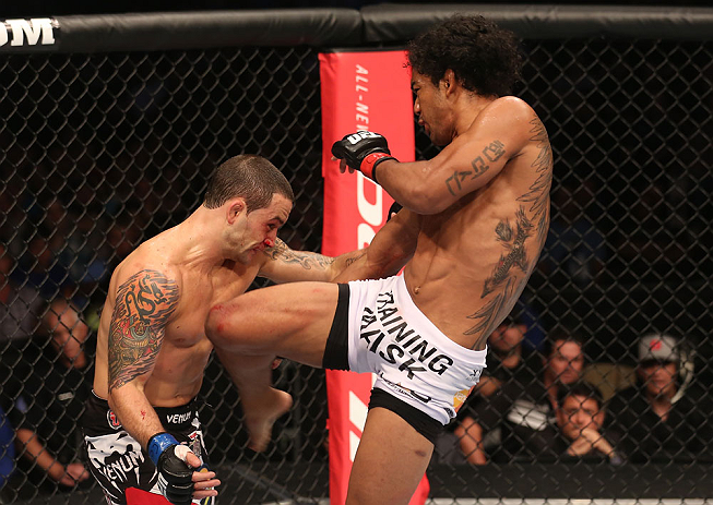 DENVER, CO - AUGUST 11: (R-L) Benson Henderson kicks Frankie Edgar during their lightweight championship bout at UFC 150 inside Pepsi Center on August 11, 2012 in Denver, Colorado. (Photo by Nick Laham/Zuffa LLC/Zuffa LLC via Getty Images)