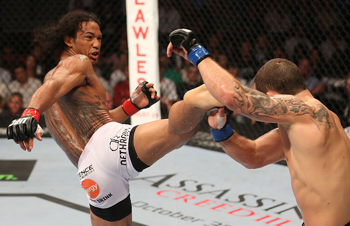 DENVER, CO - AUGUST 11: (L-R) Benson Henderson kicks Frankie Edgar during their lightweight championship bout at UFC 150 inside Pepsi Center on August 11, 2012 in Denver, Colorado. (Photo by Nick Laham/Zuffa LLC/Zuffa LLC via Getty Images)