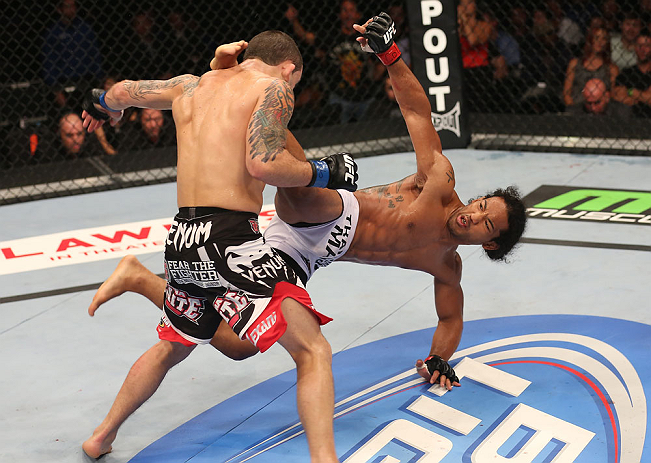 DENVER, CO - AUGUST 11: (R-L) Benson Henderson kicks Frankie Edgar during their lightweight championship bout at UFC 150 inside Pepsi Center on August 11, 2012 in Denver, Colorado. (Photo by Nick Laham/Zuffa LLC/Zuffa LLC via Getty Images)