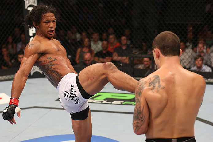 DENVER, CO - AUGUST 11: (L-R) Benson Henderson kicks Frankie Edgar during their lightweight championship bout at UFC 150 inside Pepsi Center on August 11, 2012 in Denver, Colorado. (Photo by Nick Laham/Zuffa LLC/Zuffa LLC via Getty Images)