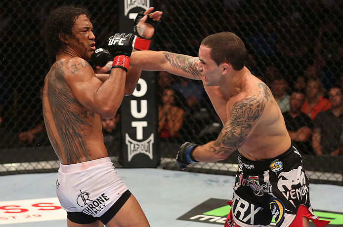 DENVER, CO - AUGUST 11: (R-L) Frankie Edgar punches Benson Henderson during their lightweight championship bout at UFC 150 inside Pepsi Center on August 11, 2012 in Denver, Colorado. (Photo by Nick Laham/Zuffa LLC/Zuffa LLC via Getty Images)