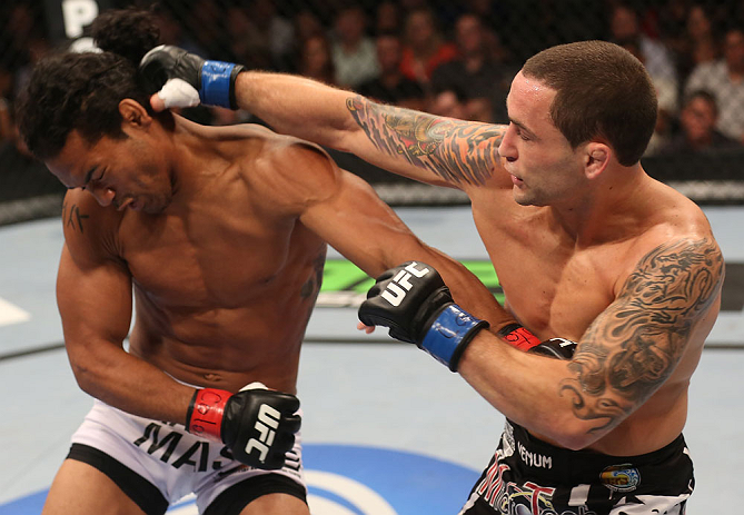 DENVER, CO - AUGUST 11: (R-L) Frankie Edgar punches Benson Henderson during their lightweight championship bout at UFC 150 inside Pepsi Center on August 11, 2012 in Denver, Colorado. (Photo by Nick Laham/Zuffa LLC/Zuffa LLC via Getty Images)