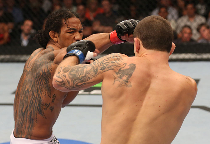 DENVER, CO - AUGUST 11: (L-R) Benson Henderson punches Frankie Edgar during their lightweight championship bout at UFC 150 inside Pepsi Center on August 11, 2012 in Denver, Colorado. (Photo by Nick Laham/Zuffa LLC/Zuffa LLC via Getty Images)