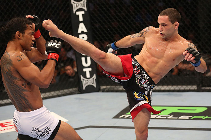 DENVER, CO - AUGUST 11: (R-L) Frankie Edgar kicks Benson Henderson during their lightweight championship bout at UFC 150 inside Pepsi Center on August 11, 2012 in Denver, Colorado. (Photo by Nick Laham/Zuffa LLC/Zuffa LLC via Getty Images)