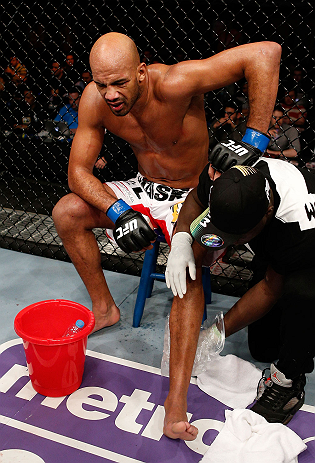 LONDON, ENGLAND - FEBRUARY 16: Cyrille Diabate sits on his stool in pain after suffering an injury against Jimi Manuwa in their light heavyweight fight during the UFC on Fuel TV event on February 16, 2013 at Wembley Arena in London, England. (Photo by J