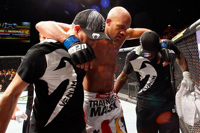 LONDON, ENGLAND - FEBRUARY 16: Cyrille Diabate is carried from the Octagon after suffering an injury against Jimi Manuwa in their light heavyweight fight during the UFC on Fuel TV event on February 16, 2013 at Wembley Arena in London, England. (Photo by