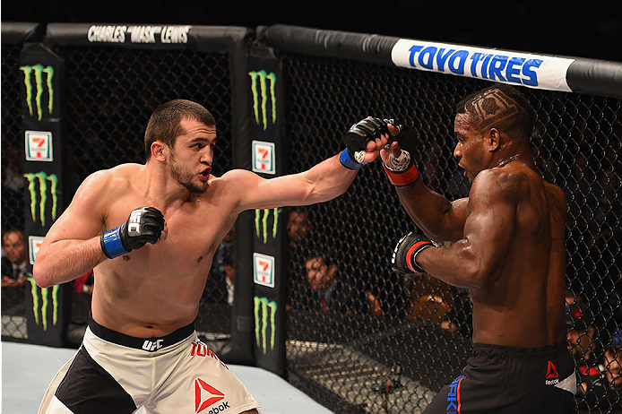 LAS VEGAS, NV - JANUARY 02: (L-R) Albert Tumenov of Russia punches Lorenz Larkin in their welterweight bout during the UFC 195 event inside MGM Grand Garden Arena on January 2, 2016 in Las Vegas, Nevada. (Photo by Josh Hedges/Zuffa LLC/Zuffa LLC via Gett