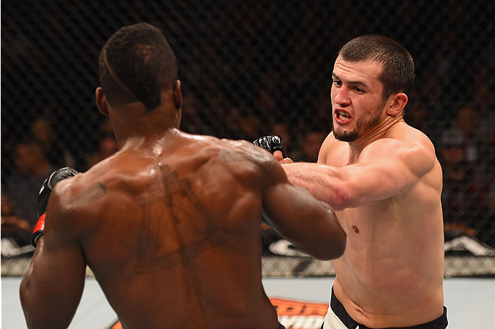LAS VEGAS, NV - JANUARY 02: (R-L) Albert Tumenov of Russia punches Lorenz Larkin in their welterweight bout during the UFC 195 event inside MGM Grand Garden Arena on January 2, 2016 in Las Vegas, Nevada. (Photo by Josh Hedges/Zuffa LLC/Zuffa LLC via Get