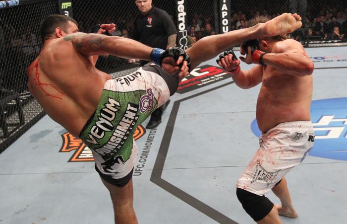 LAS VEGAS, NV - FEBRUARY 04: Fabricio Werdum (left) headkicks Roy Nelson during the UFC 143 event at Mandalay Bay Events Center on February 4, 2012 in Las Vegas, Nevada. (Photo by Nick Laham/Zuffa LLC/Zuffa LLC via Getty Images) *** Local Caption *** Fa