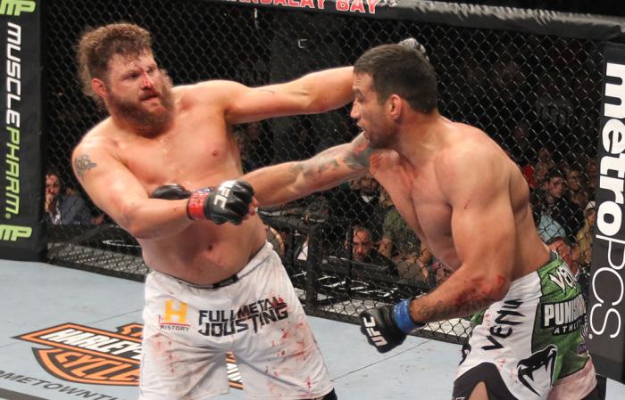 LAS VEGAS, NV - FEBRUARY 04: (L-R) Roy Nelson and Fabricio Werdum exchange punches during the UFC 143 event at Mandalay Bay Events Center on February 4, 2012 in Las Vegas, Nevada. (Photo by Nick Laham/Zuffa LLC/Zuffa LLC via Getty Images) *** Local Capt