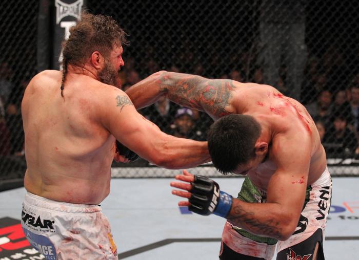 LAS VEGAS, NV - FEBRUARY 04: (L-R) Roy Nelson punches Fabricio Werdum during the UFC 143 event at Mandalay Bay Events Center on February 4, 2012 in Las Vegas, Nevada. (Photo by Nick Laham/Zuffa LLC/Zuffa LLC via Getty Images) *** Local Caption *** Roy N