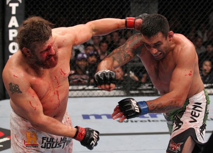 LAS VEGAS, NV - FEBRUARY 04: (L-R) Roy Nelson punches Fabricio Werdum during the UFC 143 event at Mandalay Bay Events Center on February 4, 2012 in Las Vegas, Nevada. (Photo by Nick Laham/Zuffa LLC/Zuffa LLC via Getty Images) *** Local Caption *** Roy N