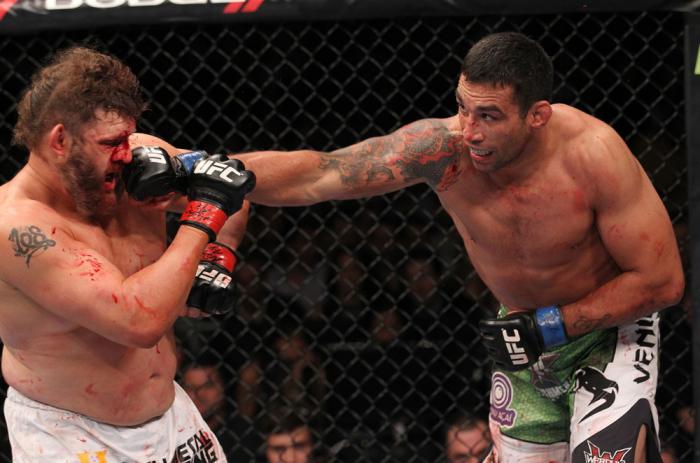 LAS VEGAS, NV - FEBRUARY 04: (R-L) Fabricio Werdum punches Roy Nelson during the UFC 143 event at Mandalay Bay Events Center on February 4, 2012 in Las Vegas, Nevada. (Photo by Nick Laham/Zuffa LLC/Zuffa LLC via Getty Images) *** Local Caption *** Fabri