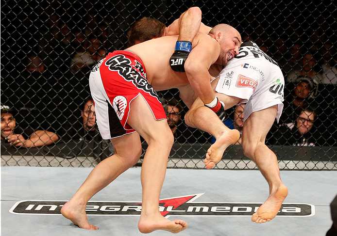 BELO HORIZONTE, BRAZIL - SEPTEMBER 04: (L-R) Glover Teixeira takes down Ryan Bader in their light heavyweight fight during the UFC on FOX Sports 1 event at Mineirinho Arena on September 4, 2013 in Belo Horizonte, Brazil. (Photo by Josh Hedges/Zuffa LLC/Z