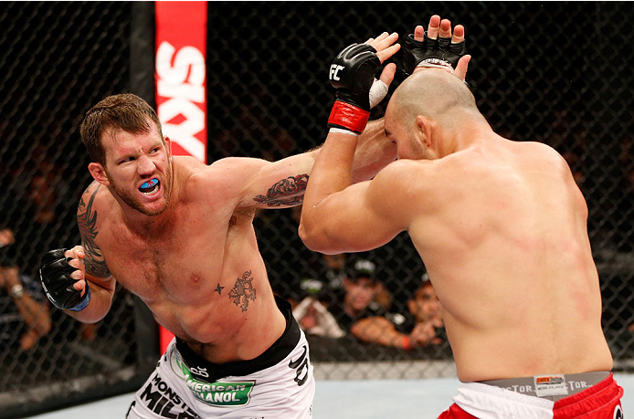 BELO HORIZONTE, BRAZIL - SEPTEMBER 04: (L-R) Ryan Bader punches Glover Teixeira in their light heavyweight fight during the UFC on FOX Sports 1 event at Mineirinho Arena on September 4, 2013 in Belo Horizonte, Brazil. (Photo by Josh Hedges/Zuffa LLC/Zuff