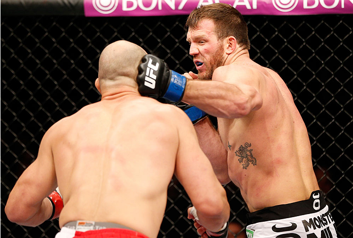 BELO HORIZONTE, BRAZIL - SEPTEMBER 04: (R-L) Ryan Bader punches Glover Teixeira in their light heavyweight fight during the UFC on FOX Sports 1 event at Mineirinho Arena on September 4, 2013 in Belo Horizonte, Brazil. (Photo by Josh Hedges/Zuffa LLC/Zuff