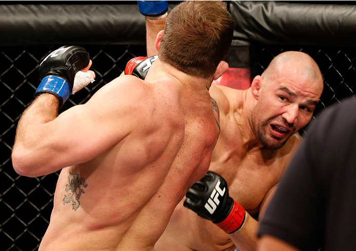 BELO HORIZONTE, BRAZIL - SEPTEMBER 04: (R-L) Glover Teixeira knocks down Ryan Bader with a punch in their light heavyweight fight during the UFC on FOX Sports 1 event at Mineirinho Arena on September 4, 2013 in Belo Horizonte, Brazil. (Photo by Josh Hedg