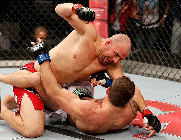 BELO HORIZONTE, BRAZIL - SEPTEMBER 04: (L-R) Glover Teixeira punches Ryan Bader in their light heavyweight fight during the UFC on FOX Sports 1 event at Mineirinho Arena on September 4, 2013 in Belo Horizonte, Brazil. (Photo by Josh Hedges/Zuffa LLC/Zuff