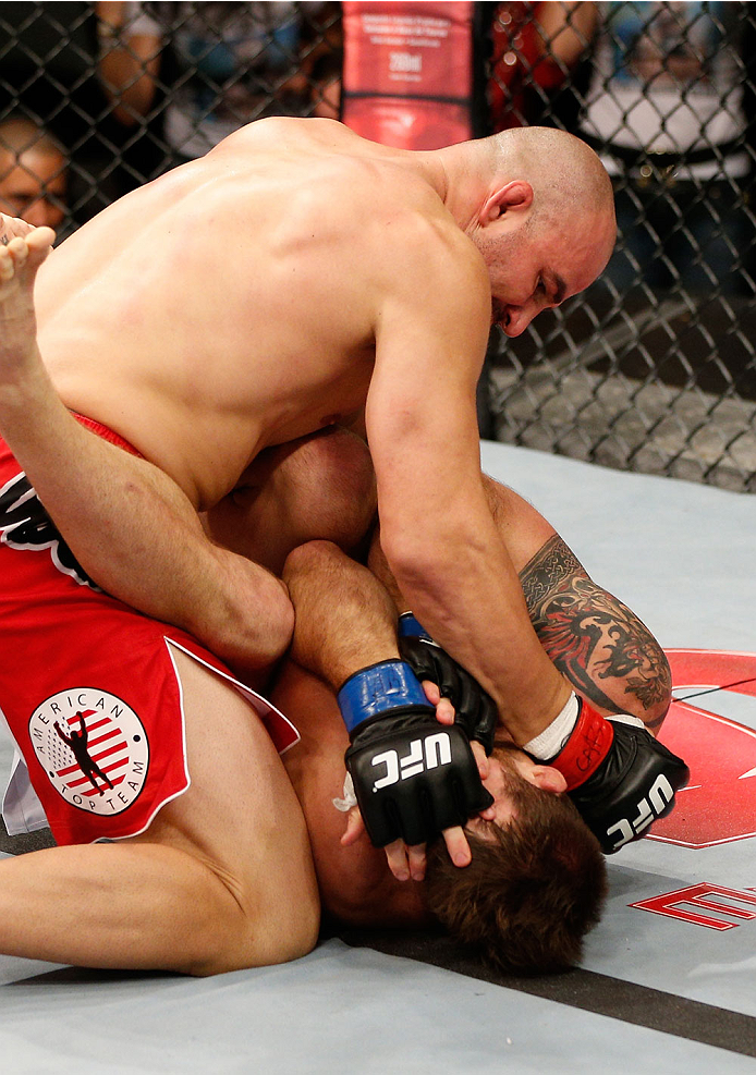 BELO HORIZONTE, BRAZIL - SEPTEMBER 04: (L-R) Glover Teixeira punches Ryan Bader in their light heavyweight fight during the UFC on FOX Sports 1 event at Mineirinho Arena on September 4, 2013 in Belo Horizonte, Brazil. (Photo by Josh Hedges/Zuffa LLC/Zuff