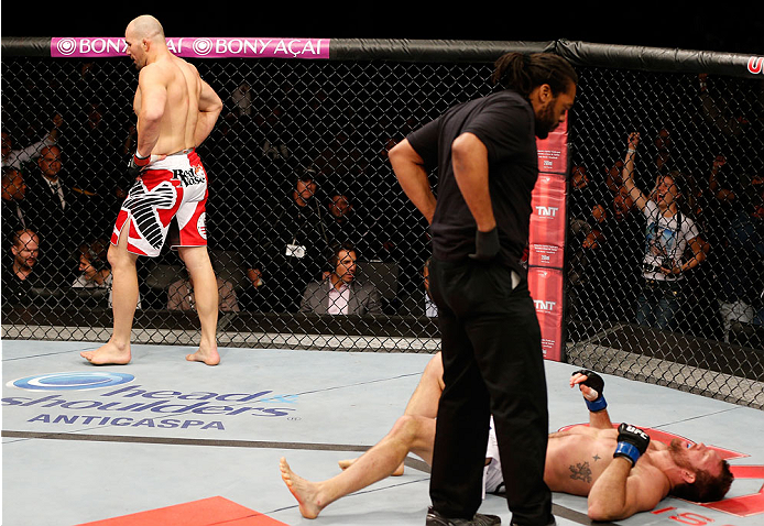 BELO HORIZONTE, BRAZIL - SEPTEMBER 04: Glover Teixeira (L) reacts after knocking out Ryan Bader in their light heavyweight fight during the UFC on FOX Sports 1 event at Mineirinho Arena on September 4, 2013 in Belo Horizonte, Brazil. (Photo by Josh Hedge