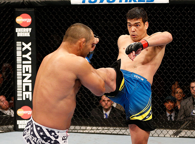 ANAHEIM, CA - FEBRUARY 23: (R-L) Lyoto Machida kicks Dan Henderson in their light heavyweight bout during UFC 157 at Honda Center on February 23, 2013 in Anaheim, California. (Photo by Josh Hedges/Zuffa LLC/Zuffa LLC via Getty Images) *** Local Caption
