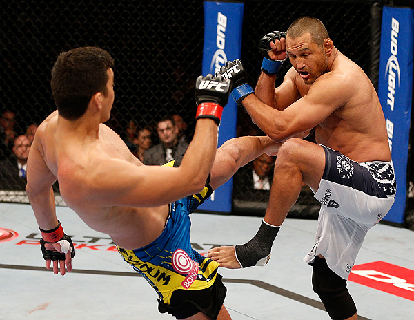 ANAHEIM, CA - FEBRUARY 23: (L-R) Lyoto Machida kicks Dan Henderson in their light heavyweight bout during UFC 157 at Honda Center on February 23, 2013 in Anaheim, California. (Photo by Josh Hedges/Zuffa LLC/Zuffa LLC via Getty Images) *** Local Caption
