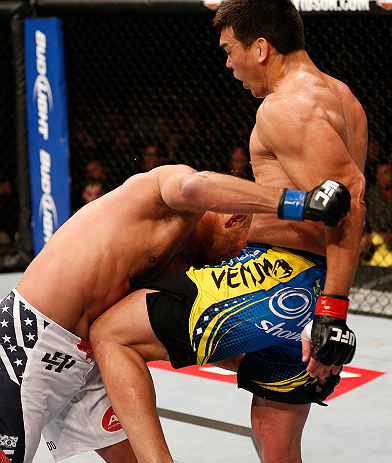 ANAHEIM, CA - FEBRUARY 23: (R-L) Lyoto Machida knees Dan Henderson in their light heavyweight bout during UFC 157 at Honda Center on February 23, 2013 in Anaheim, California. (Photo by Josh Hedges/Zuffa LLC/Zuffa LLC via Getty Images) *** Local Caption