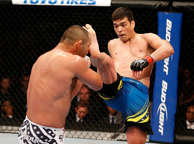 ANAHEIM, CA - FEBRUARY 23: (R-L) Lyoto Machida kicks Dan Henderson in their light heavyweight bout during UFC 157 at Honda Center on February 23, 2013 in Anaheim, California. (Photo by Josh Hedges/Zuffa LLC/Zuffa LLC via Getty Images) *** Local Caption