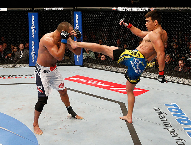 ANAHEIM, CA - FEBRUARY 23: (R-L) Lyoto Machida kicks Dan Henderson in their light heavyweight bout during UFC 157 at Honda Center on February 23, 2013 in Anaheim, California. (Photo by Josh Hedges/Zuffa LLC/Zuffa LLC via Getty Images) *** Local Caption