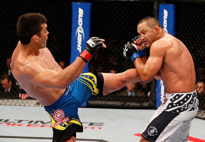 ANAHEIM, CA - FEBRUARY 23: (L-R) Lyoto Machida kicks Dan Henderson in their light heavyweight bout during UFC 157 at Honda Center on February 23, 2013 in Anaheim, California. (Photo by Josh Hedges/Zuffa LLC/Zuffa LLC via Getty Images) *** Local Caption