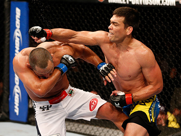 ANAHEIM, CA - FEBRUARY 23: (R-L) Lyoto Machida punches Dan Henderson in their light heavyweight bout during UFC 157 at Honda Center on February 23, 2013 in Anaheim, California. (Photo by Josh Hedges/Zuffa LLC/Zuffa LLC via Getty Images) *** Local Captio