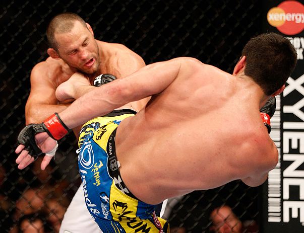 ANAHEIM, CA - FEBRUARY 23: (R-L) Lyoto Machida kicks Dan Henderson in their light heavyweight bout during UFC 157 at Honda Center on February 23, 2013 in Anaheim, California. (Photo by Josh Hedges/Zuffa LLC/Zuffa LLC via Getty Images) *** Local Caption