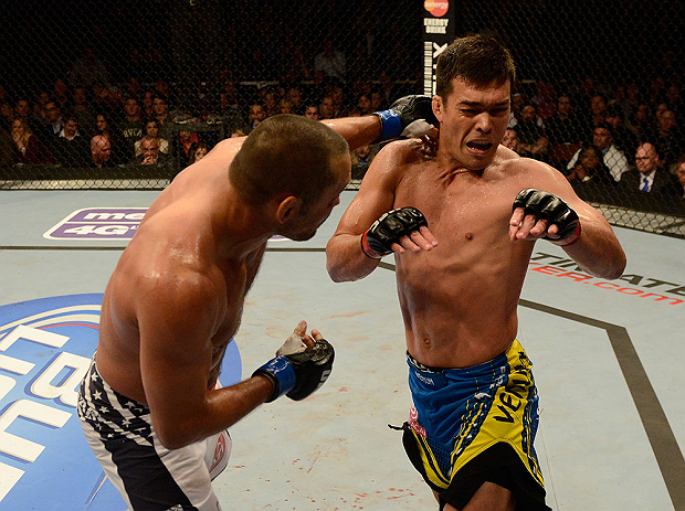 ANAHEIM, CA - FEBRUARY 23: (L-R) Dan Henderson punches Lyoto Machida in their light heavyweight bout during UFC 157 at Honda Center on February 23, 2013 in Anaheim, California. (Photo by Donald Miralle/Zuffa LLC/Zuffa LLC via Getty Images) *** Local Cap