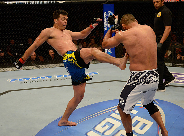 ANAHEIM, CA - FEBRUARY 23: (L-R) Lyoto Machida kicks Dan Henderson in their light heavyweight bout during UFC 157 at Honda Center on February 23, 2013 in Anaheim, California. (Photo by Donald Miralle/Zuffa LLC/Zuffa LLC via Getty Images) *** Local Capti