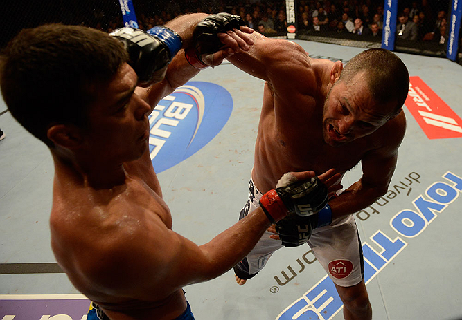 ANAHEIM, CA - FEBRUARY 23: (R-L) Dan Henderson punches Lyoto Machida in their light heavyweight bout during UFC 157 at Honda Center on February 23, 2013 in Anaheim, California. (Photo by Donald Miralle/Zuffa LLC/Zuffa LLC via Getty Images) *** Local Cap