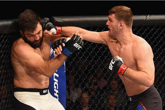 LAS VEGAS, NV - JANUARY 02: (R-L) Stipe Miocic punches Andrei Arlovski in their heavyweight bout during the UFC 195 event inside MGM Grand Garden Arena on January 2, 2016 in Las Vegas, Nevada. (Photo by Josh Hedges/Zuffa LLC/Zuffa LLC via Getty Images)
