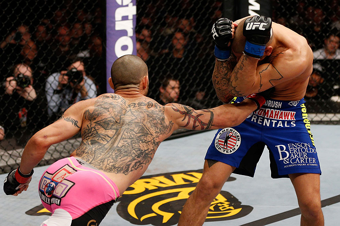 LONDON, ENGLAND - FEBRUARY 16: (L-R) Cub Swanson punches Dustin Poirier in their featherweight fight during the UFC on Fuel TV event on February 16, 2013 at Wembley Arena in London, England. (Photo by Josh Hedges/Zuffa LLC/Zuffa LLC via Getty Images)