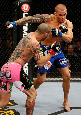 LONDON, ENGLAND - FEBRUARY 16: (L-R) Cub Swanson punches Dustin Poirier in their featherweight fight during the UFC on Fuel TV event on February 16, 2013 at Wembley Arena in London, England. (Photo by Josh Hedges/Zuffa LLC/Zuffa LLC via Getty Images)