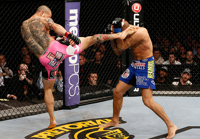 LONDON, ENGLAND - FEBRUARY 16: (L-R) Cub Swanson kicks Dustin Poirier in their featherweight fight during the UFC on Fuel TV event on February 16, 2013 at Wembley Arena in London, England. (Photo by Josh Hedges/Zuffa LLC/Zuffa LLC via Getty Images)