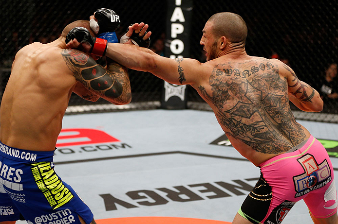 LONDON, ENGLAND - FEBRUARY 16: (R-L) Cub Swanson punches Dustin Poirier in their featherweight fight during the UFC on Fuel TV event on February 16, 2013 at Wembley Arena in London, England. (Photo by Josh Hedges/Zuffa LLC/Zuffa LLC via Getty Images)