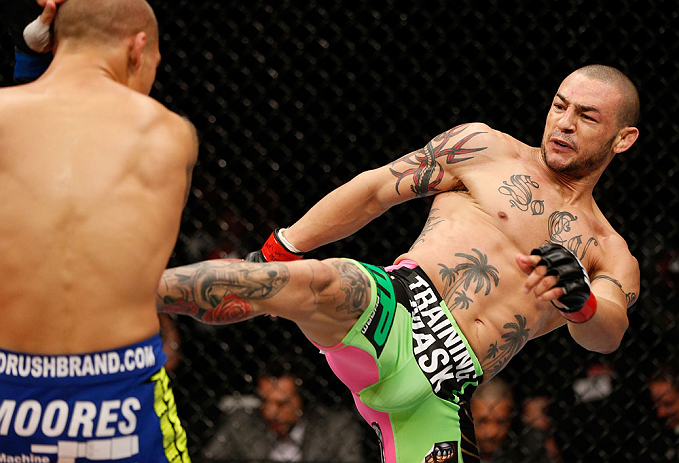LONDON, ENGLAND - FEBRUARY 16: (R-L) Cub Swanson kicks Dustin Poirier in their featherweight fight during the UFC on Fuel TV event on February 16, 2013 at Wembley Arena in London, England. (Photo by Josh Hedges/Zuffa LLC/Zuffa LLC via Getty Images)