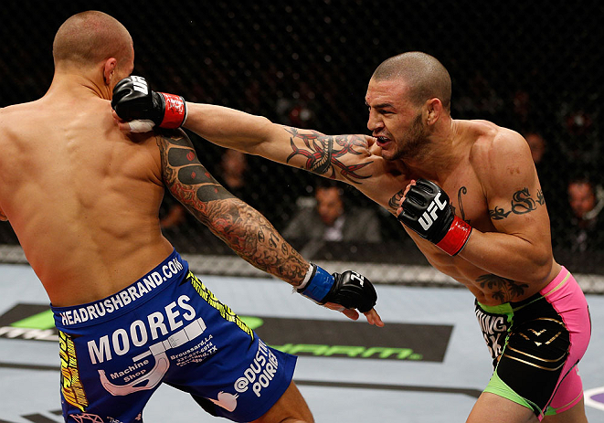 LONDON, ENGLAND - FEBRUARY 16: (R-L) Cub Swanson punches Dustin Poirier in their featherweight fight during the UFC on Fuel TV event on February 16, 2013 at Wembley Arena in London, England. (Photo by Josh Hedges/Zuffa LLC/Zuffa LLC via Getty Images)