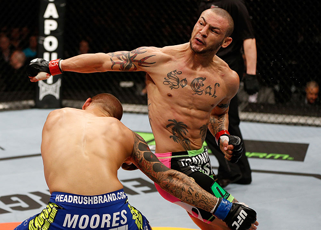 LONDON, ENGLAND - FEBRUARY 16: (R-L) Cub Swanson throws a spinning back fist against Dustin Poirier in their featherweight fight during the UFC on Fuel TV event on February 16, 2013 at Wembley Arena in London, England. (Photo by Josh Hedges/Zuffa LLC/Zu