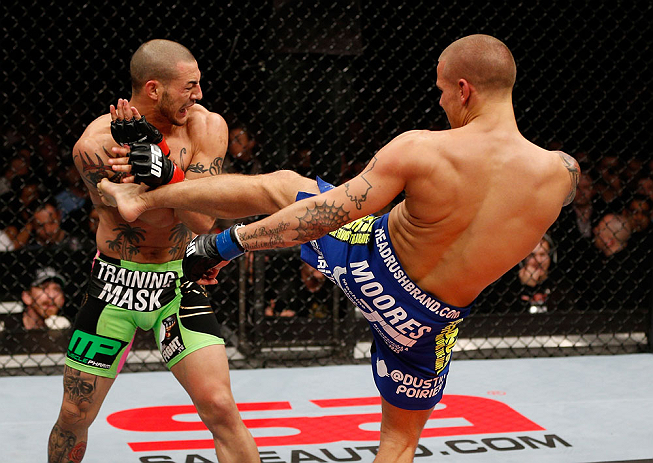 LONDON, ENGLAND - FEBRUARY 16: (R-L) Dustin Poirier kicks Cub Swanson in their featherweight fight during the UFC on Fuel TV event on February 16, 2013 at Wembley Arena in London, England. (Photo by Josh Hedges/Zuffa LLC/Zuffa LLC via Getty Images)