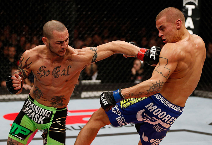 LONDON, ENGLAND - FEBRUARY 16: (L-R) Cub Swanson punches Dustin Poirier in their featherweight fight during the UFC on Fuel TV event on February 16, 2013 at Wembley Arena in London, England. (Photo by Josh Hedges/Zuffa LLC/Zuffa LLC via Getty Images)